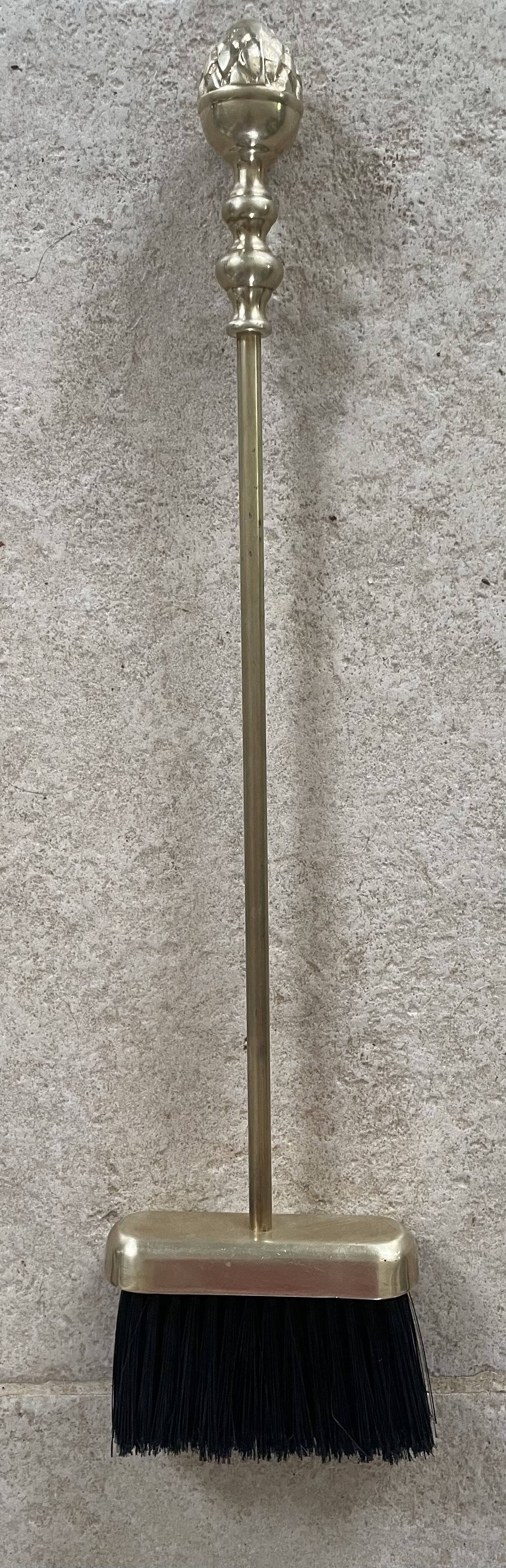 Brass fireplace tools in the style of Maison Baguès.