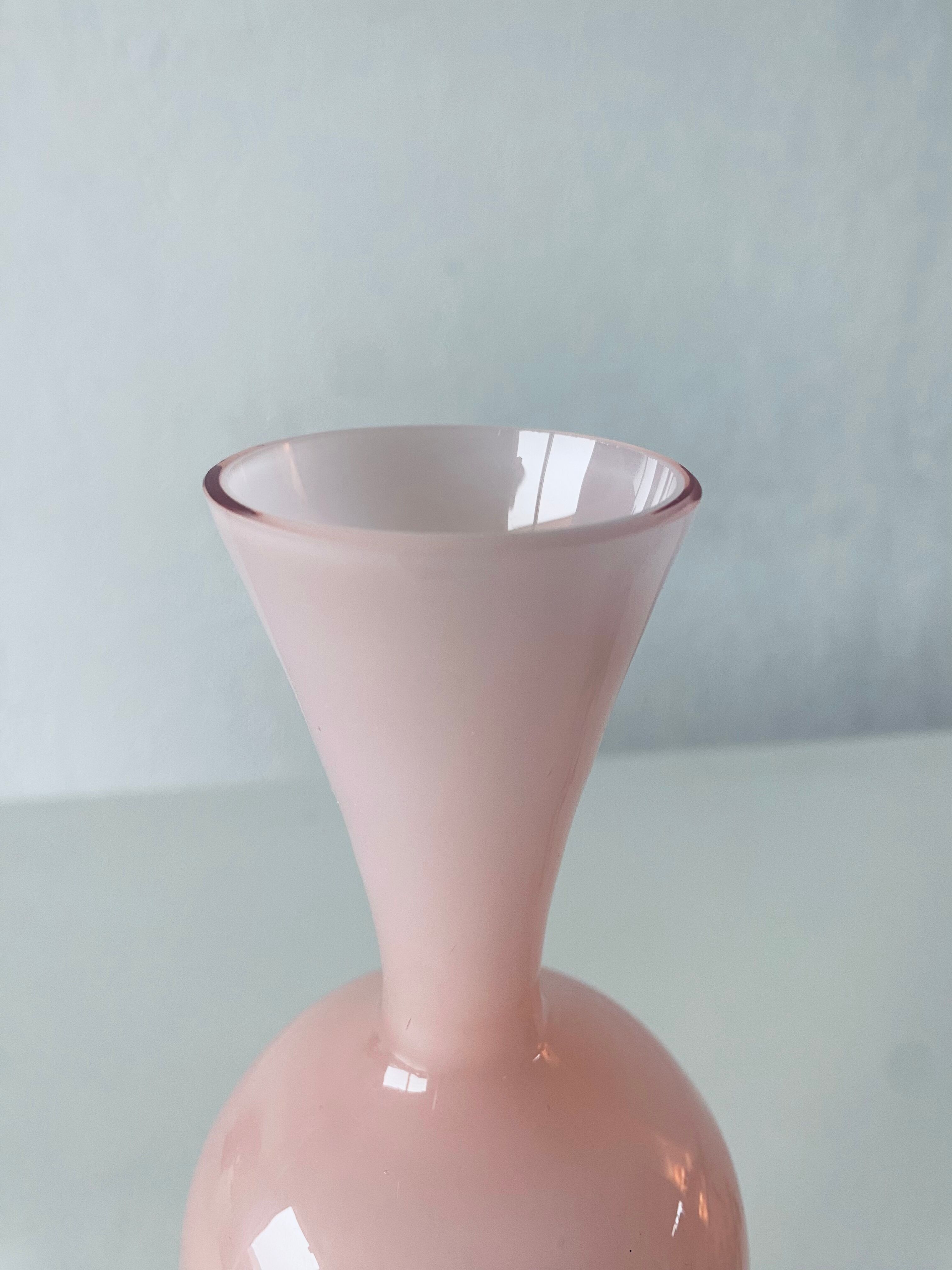Old vase in pink opaline