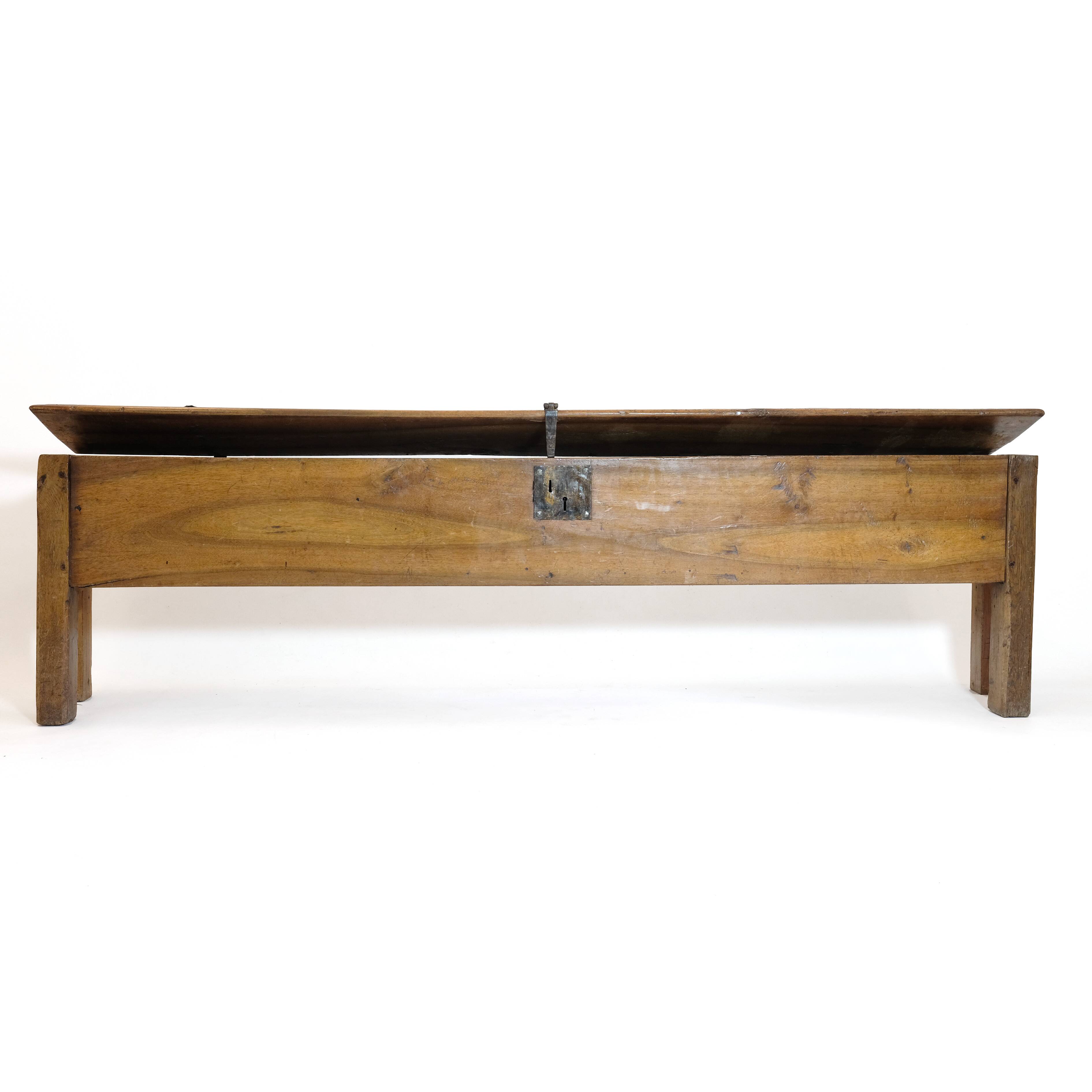 Long walnut grain chest forming a bench, 220cm.