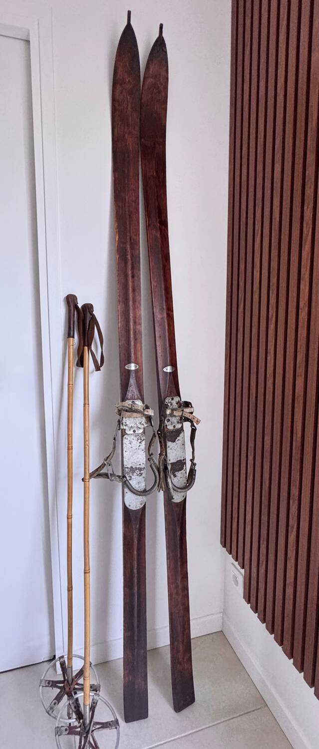 Antique wooden skis with vintage poles