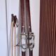 Antique wooden skis with vintage poles