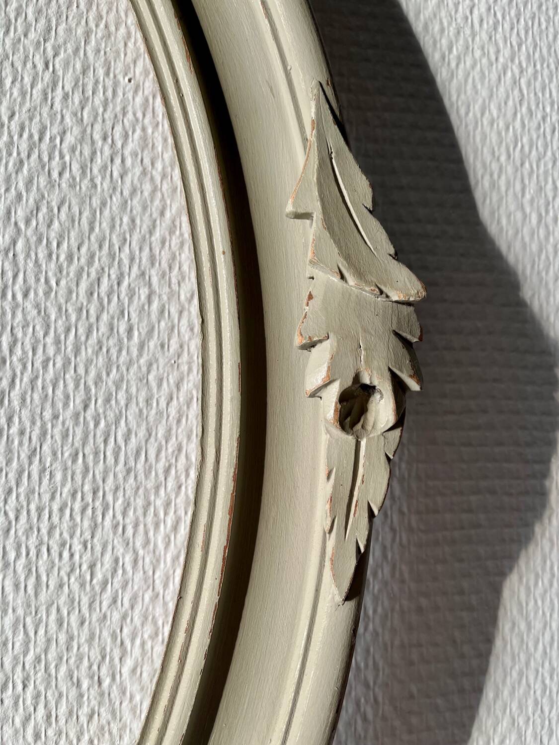 Oval frame in weathered wood