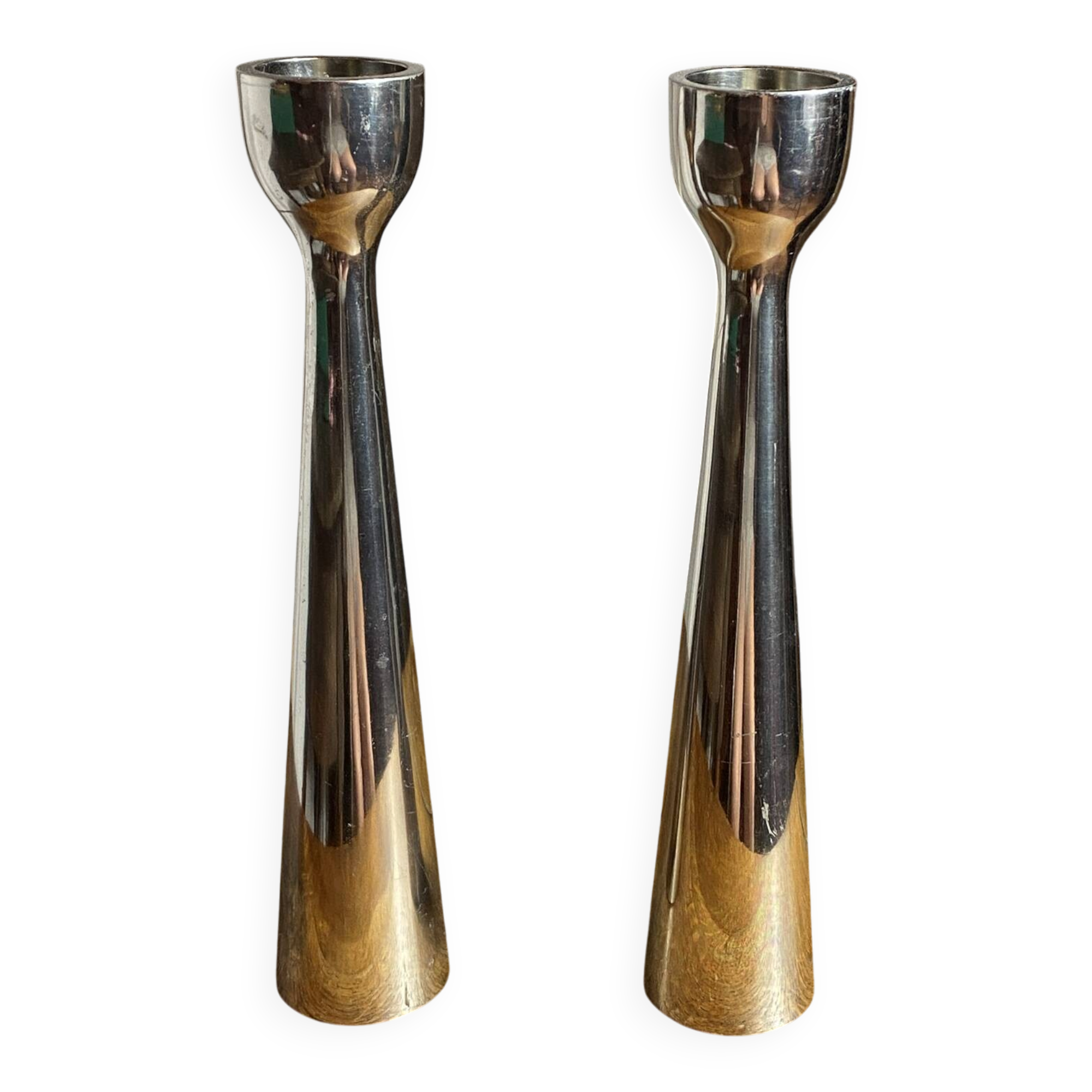 Pair of polished aluminium candlesticks