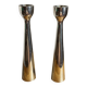 Pair of polished aluminium candlesticks
