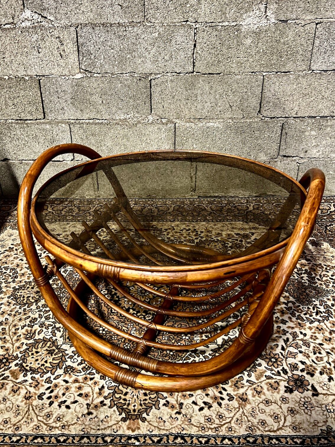 Vintage round coffee table in rattan and smoked glass
