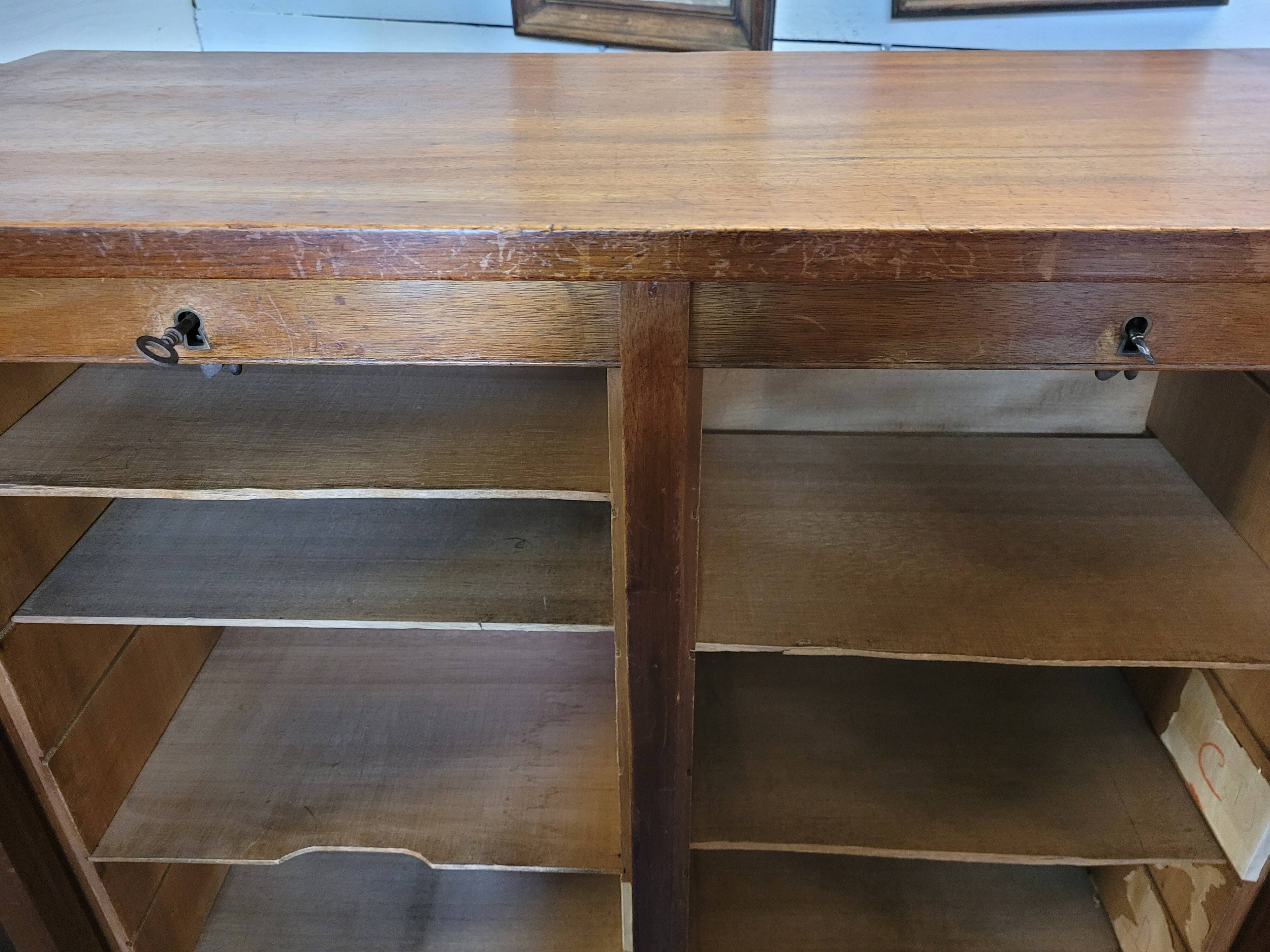 Double curtain binder in blond mahogany