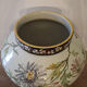 Large polychrome ceramic cache-pot with floral decoration.