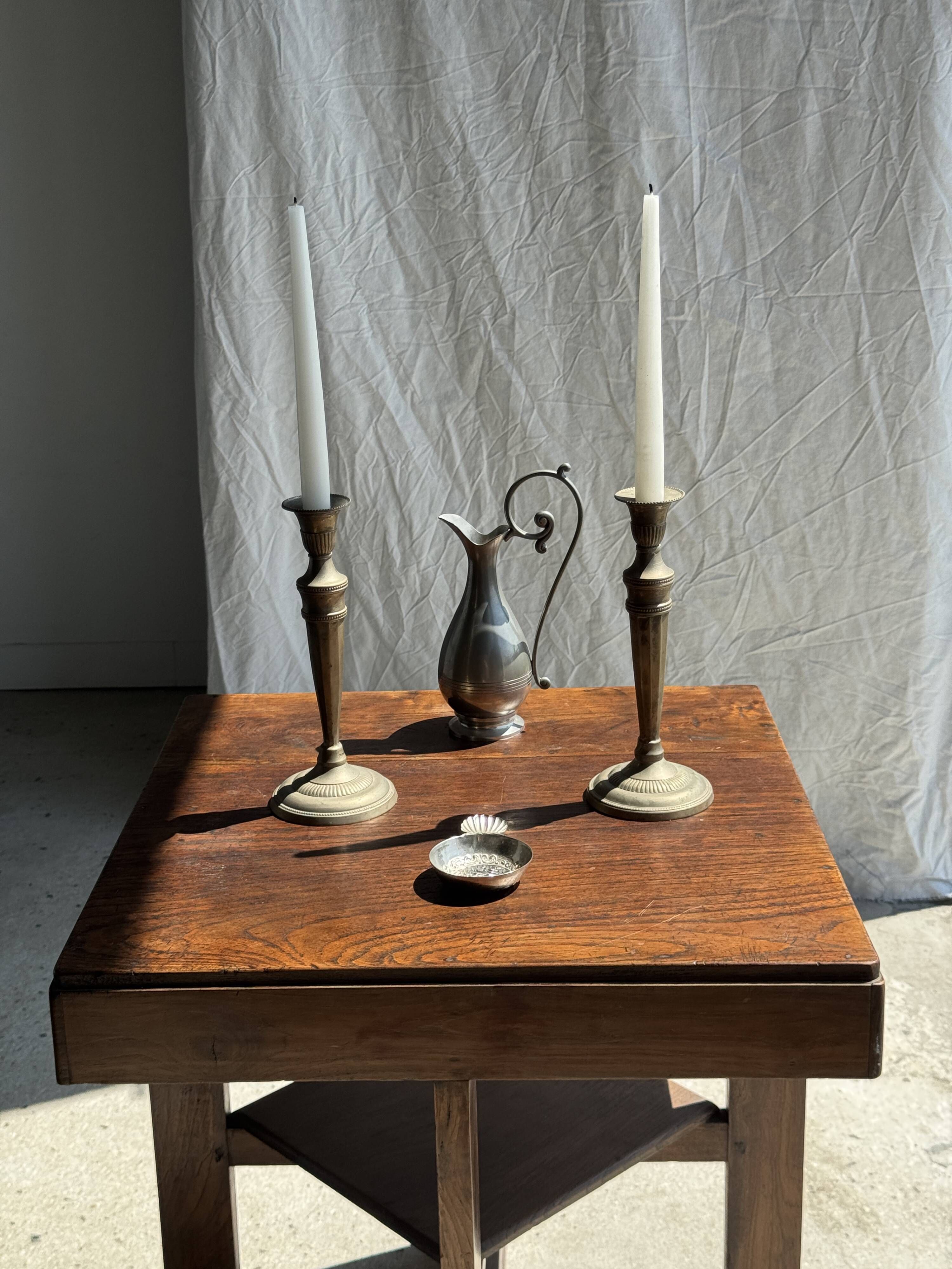 Pair of classic candlesticks in patinated gold metal H25