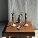 Pair of classic candlesticks in patinated gold metal H25