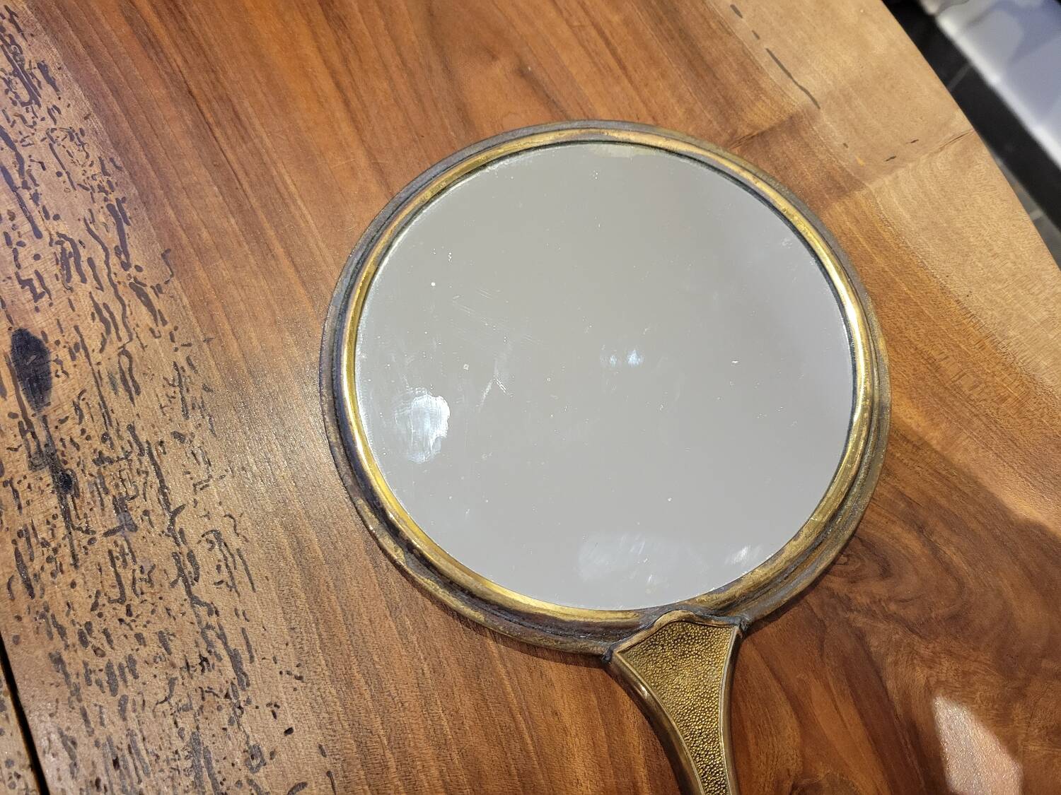 Brass hand mirror with magnifying back