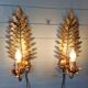 Pair of gold metal wall sconces in Hollywood Regency style, 1970s.