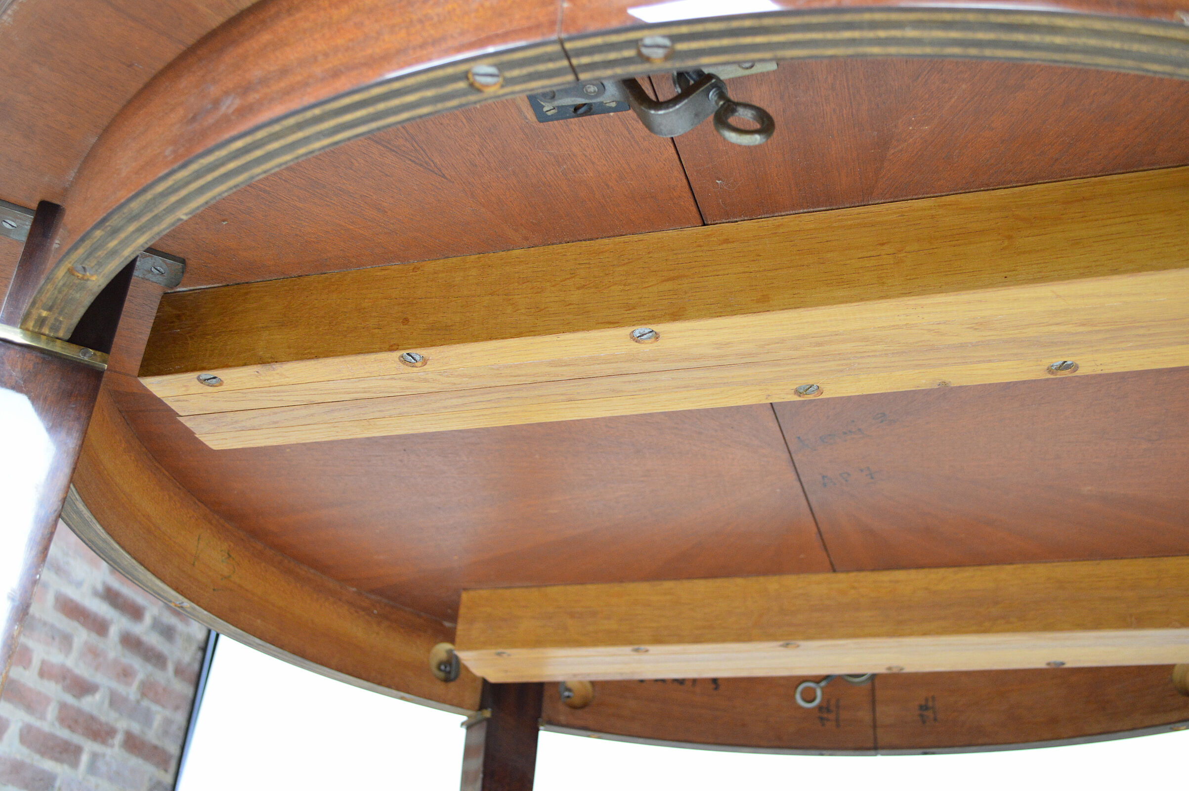 Art Deco mahogany round table by Jacques Adnet around 1940