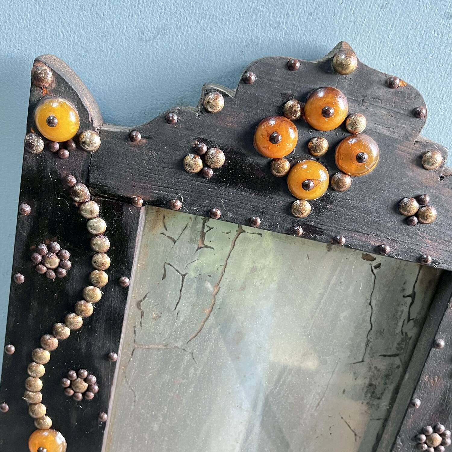 Antique wooden studded mirror