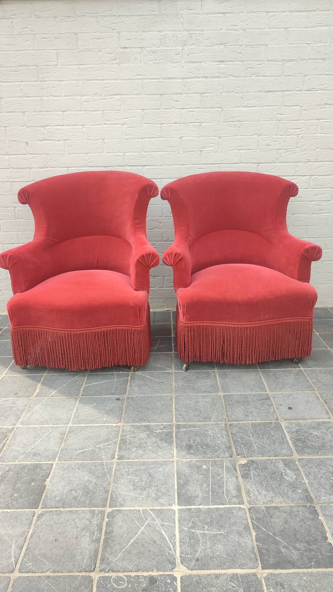 Pair of fringed crapaud armchairs