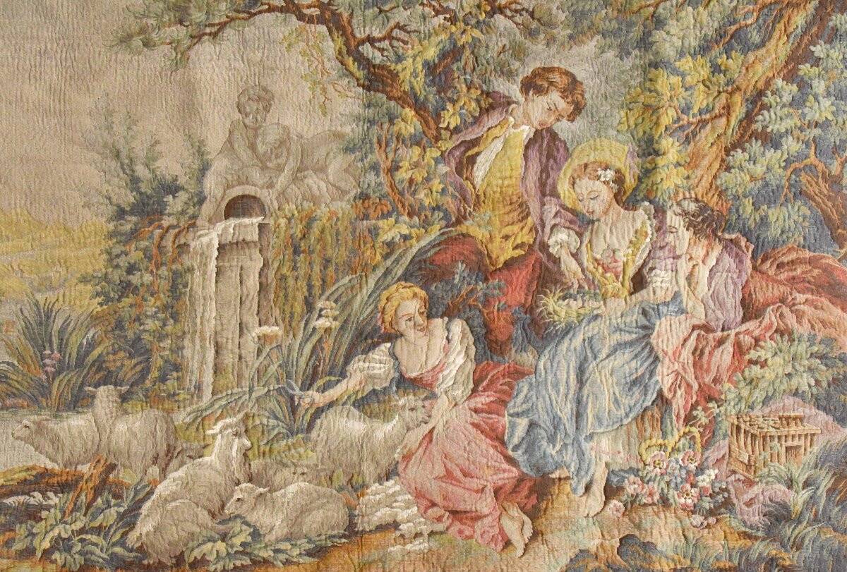 Wall tapestry featuring a pastoral scene.