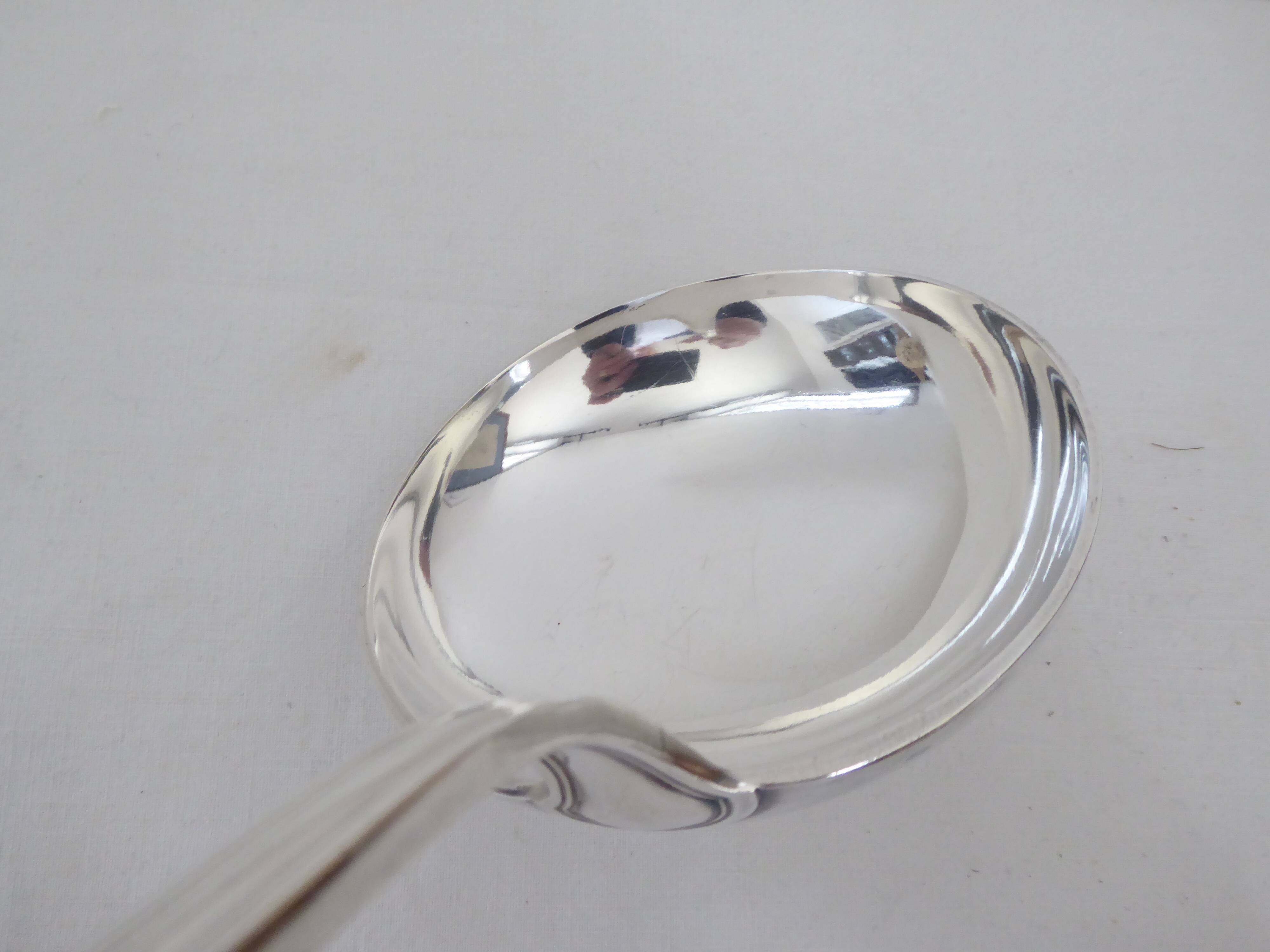 Silver metal ladle