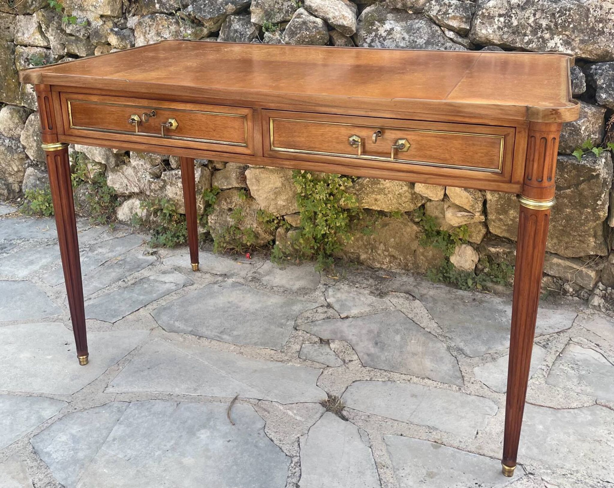 Louis XVI style mahogany flat desk from the late 19th century