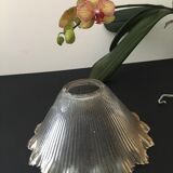 Transparent, slightly amber glass tulip. Vertical streaks.
