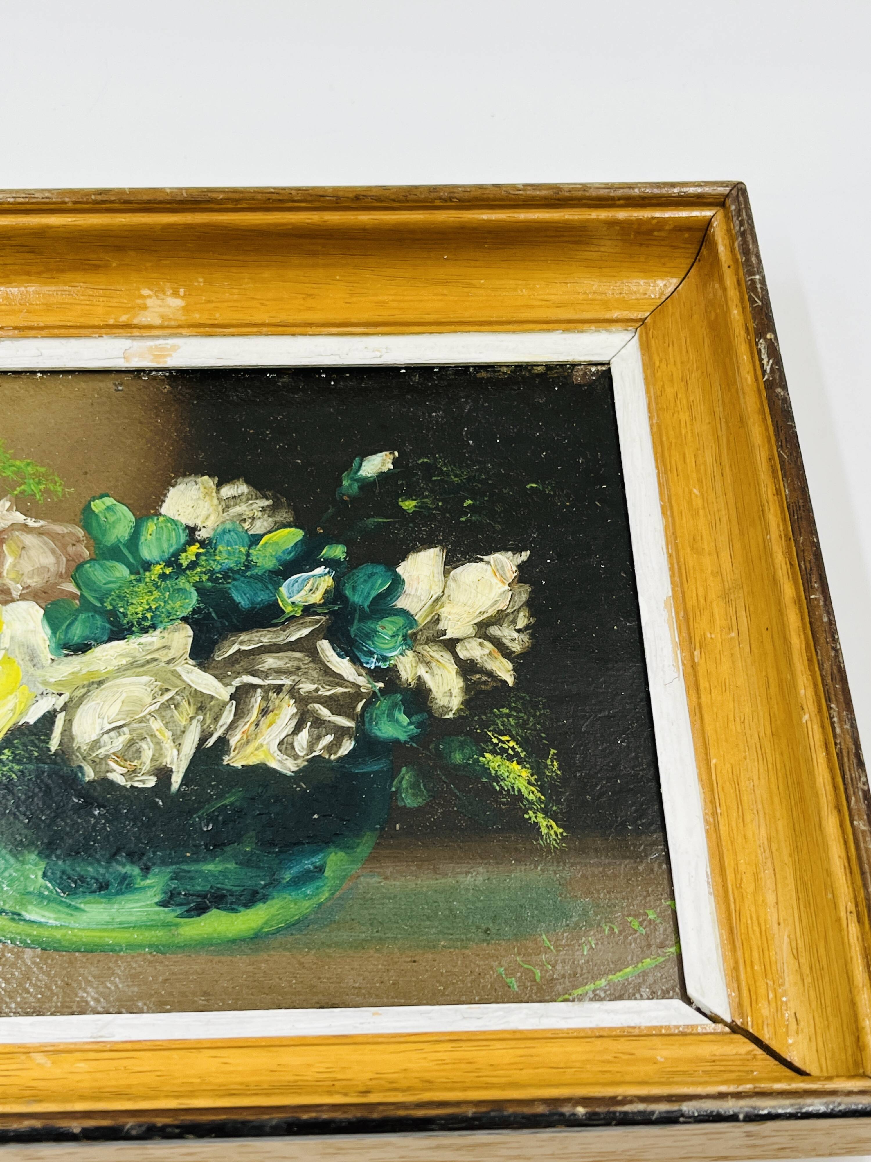 Pair of small framed vintage floral oils