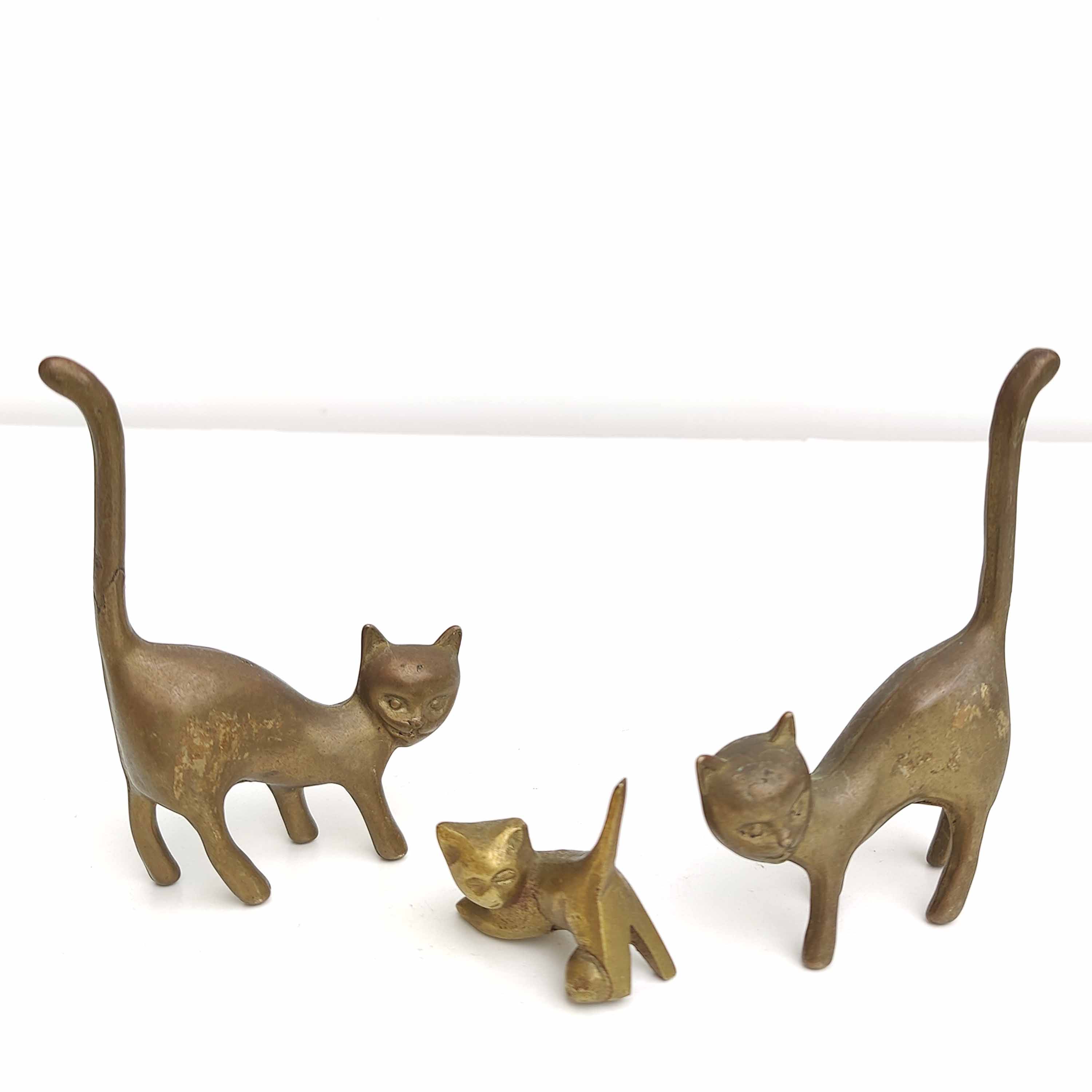 Couple brass cats and their baby cat