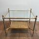 Pair of neoclassical side tables in steel and brass by Maison Jansen.