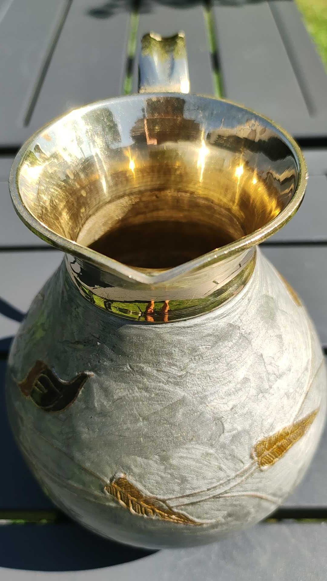 Decorative decanter in solid enamelled brass