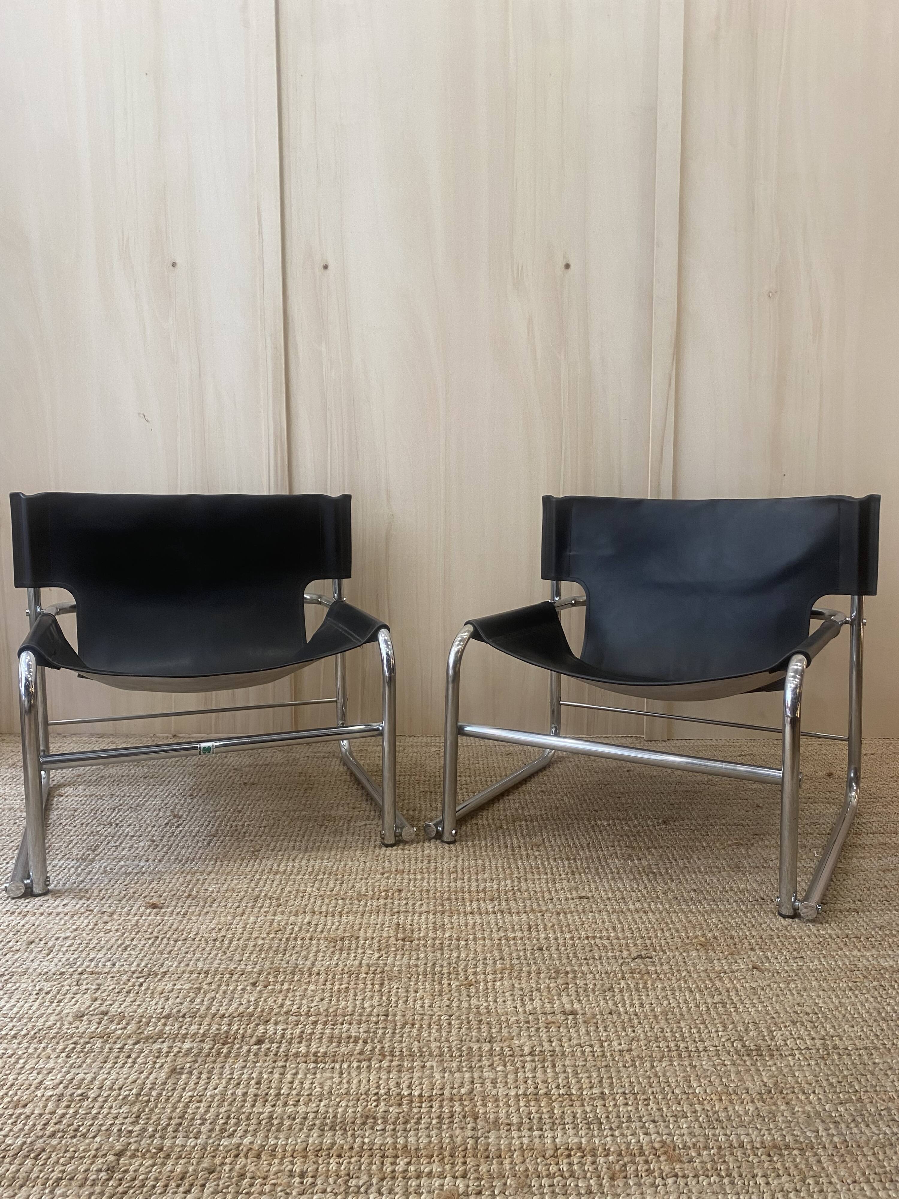Black leather armchairs with a metal frame by Rodney Kinsman.