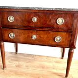 Louis XVI style wooden veneered chest of drawers with a marble top.