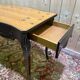 Table console de style Louis XV en bois noirci.