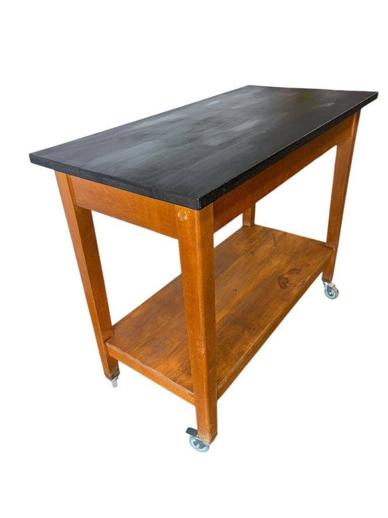 Vintage wooden high table on wheels