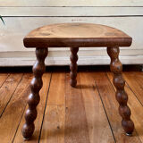 Low vintage wooden tripod stool