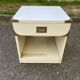 White Scandinavian bedside table in boat style made of wood.