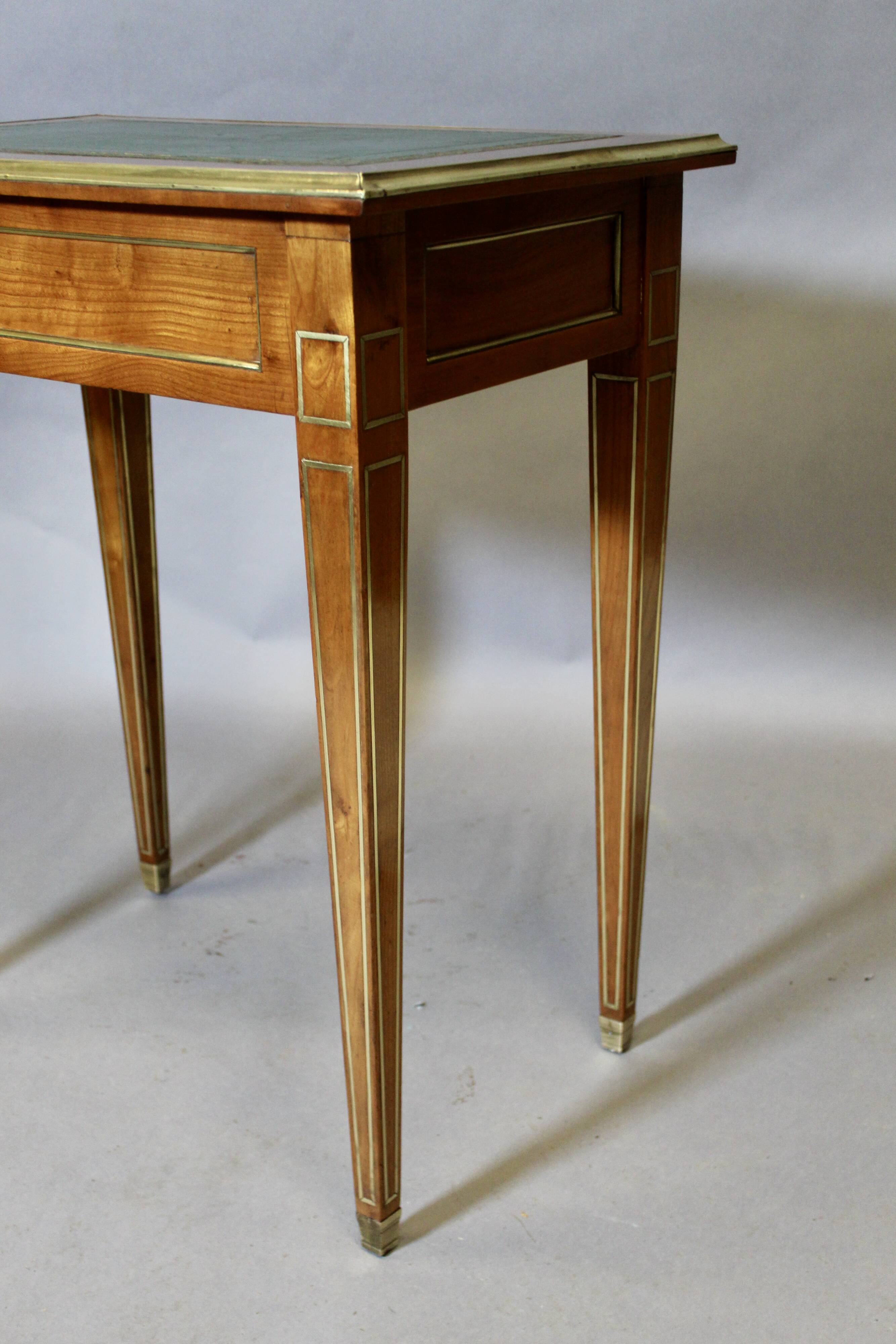 Louis XVI writing table with brass beading