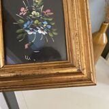 Golden frame with painting bouquet of flowers