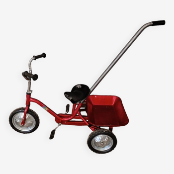 Vintage red metal tricycle