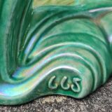 Old barbotine statue seagulls on the wave