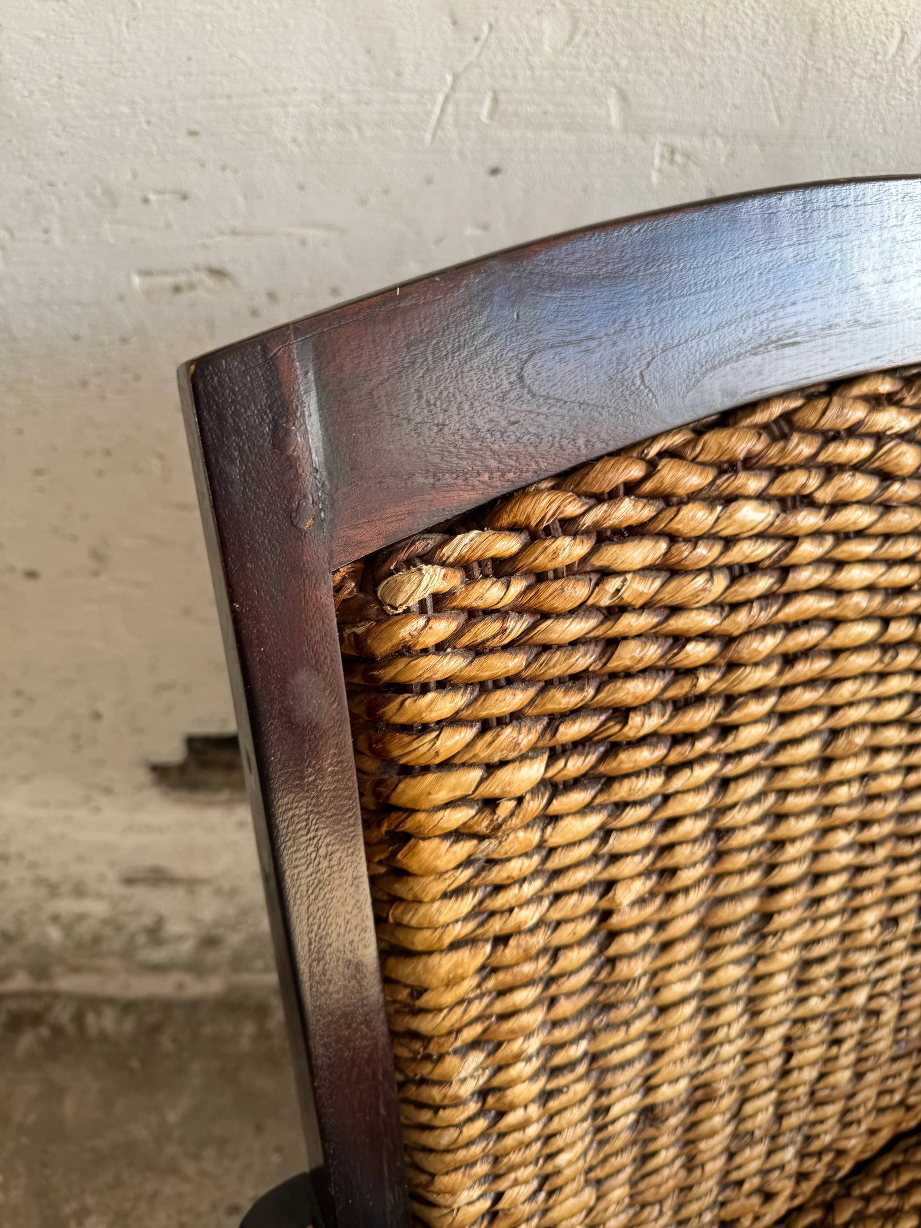 Set of two colonial dark-brown wooden armchairs with natural rattan seating (pair)