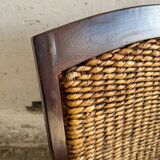 Set of two colonial dark-brown wooden armchairs with natural rattan seating (pair)