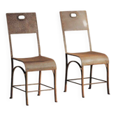 Paire de chaises en acier et tôle rivetée, vers 1920