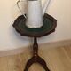 Harness or pedestal table in wooden tripod foot and green leather top