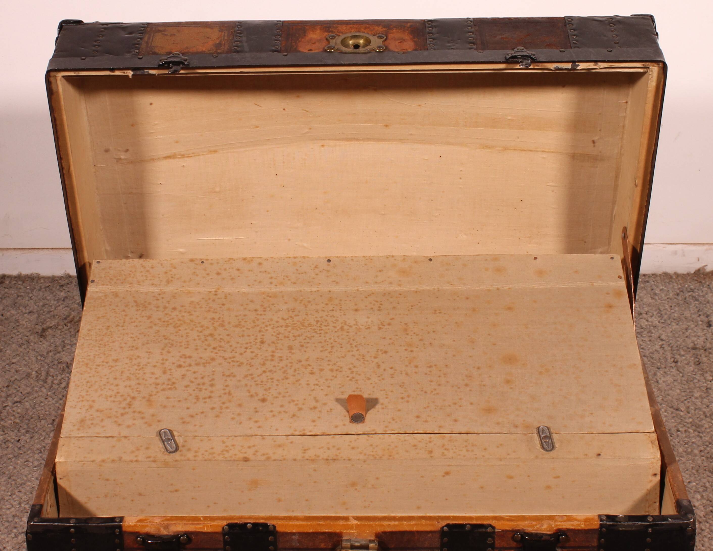 travel trunk from the early 20th century made of leather and wood