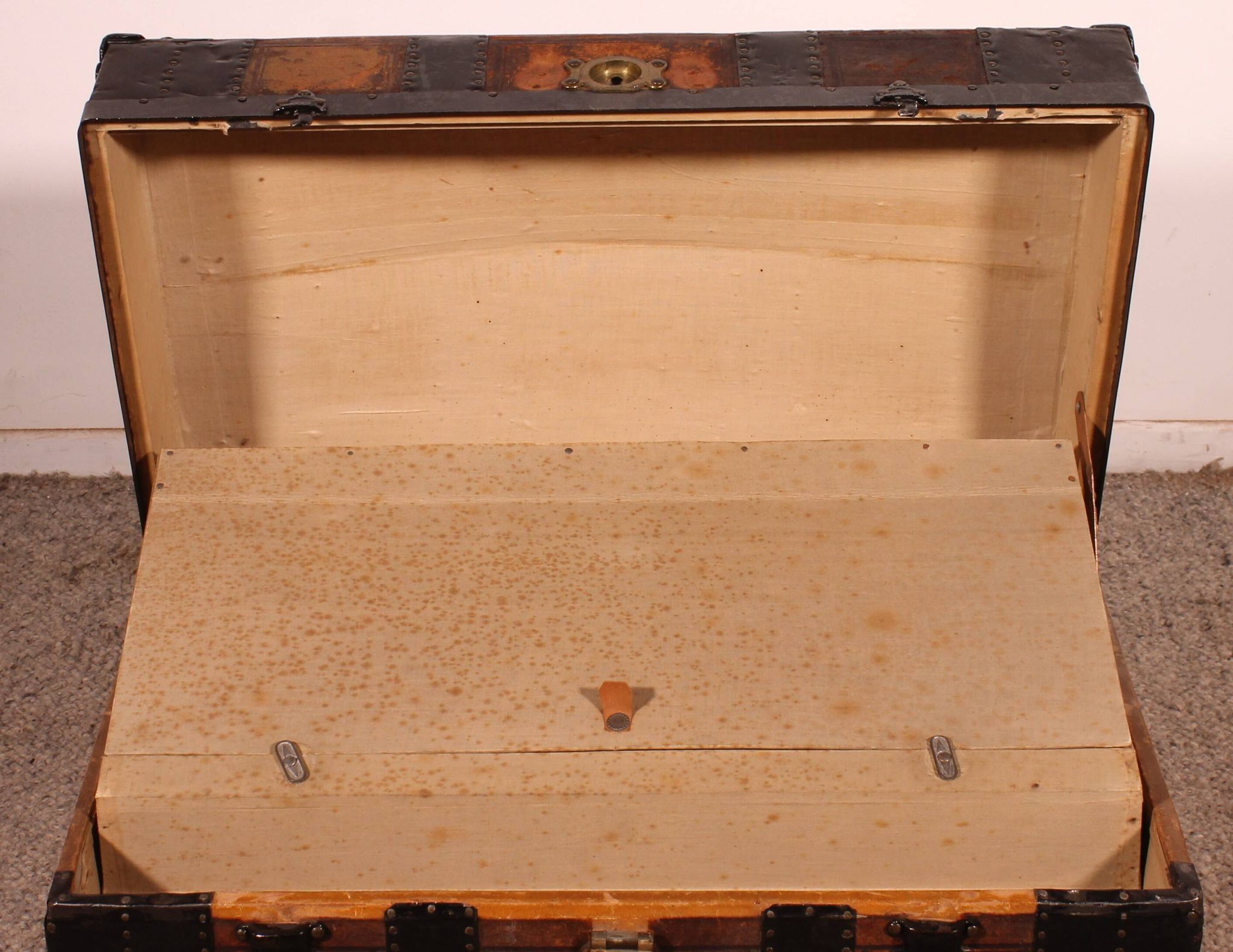 travel trunk from the early 20th century made of leather and wood