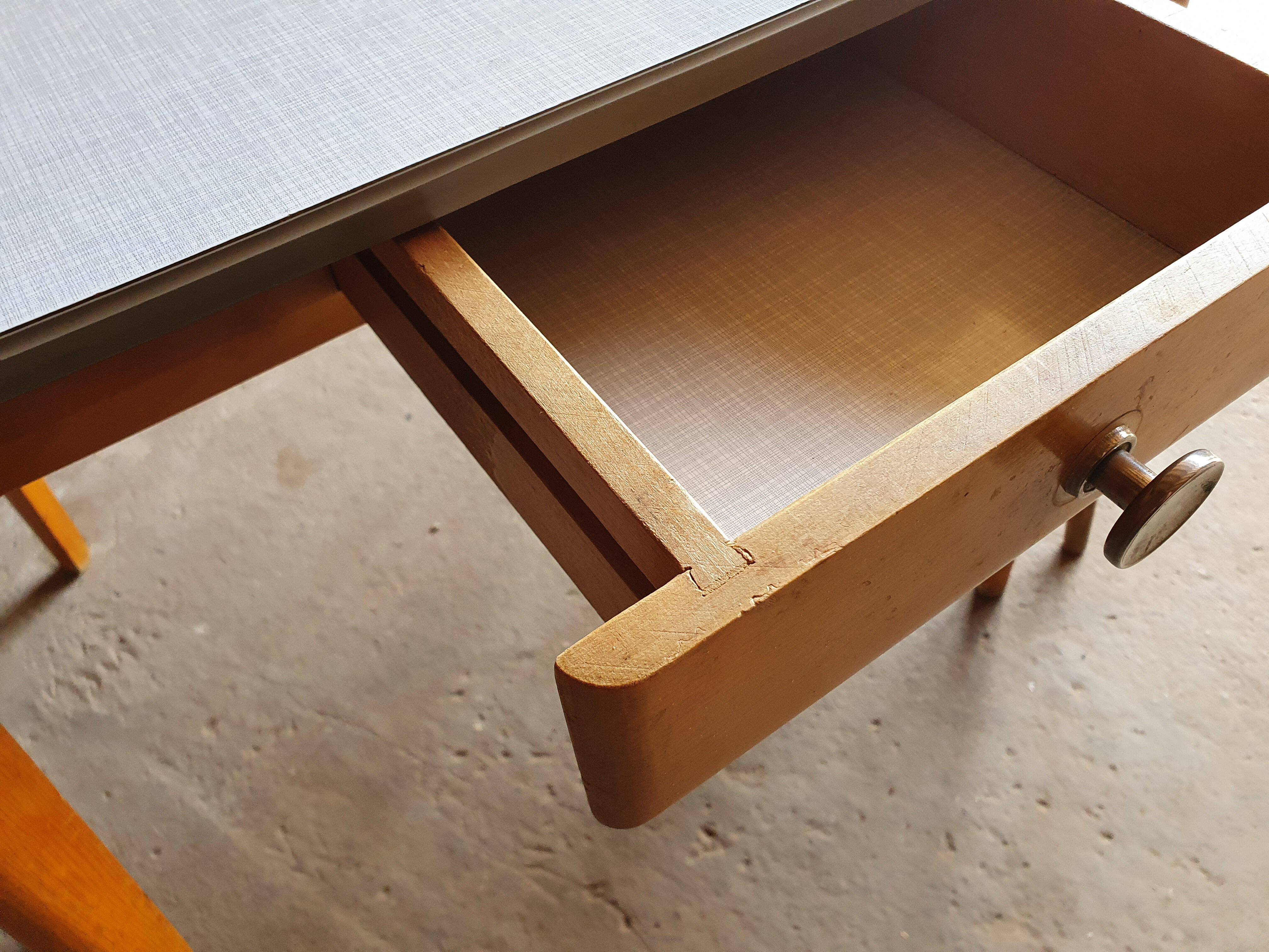 Together two Scandinavian chairs and its wooden and formica table