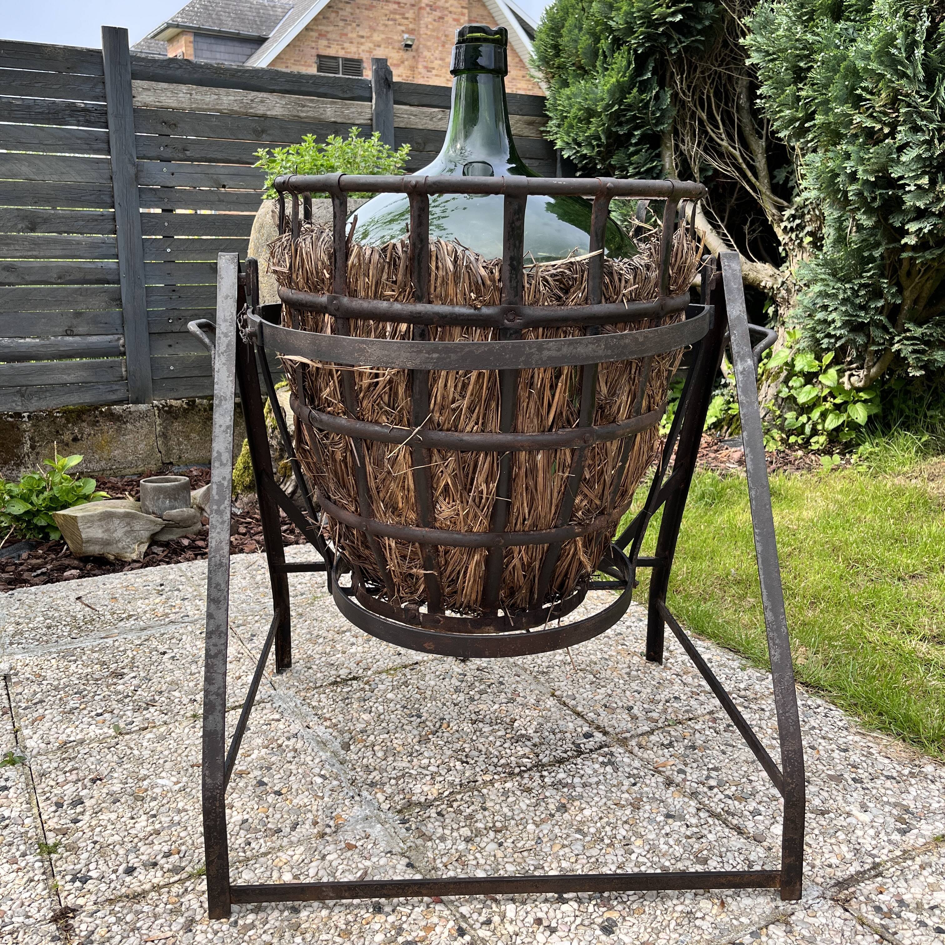 Demijohn on steel rocker