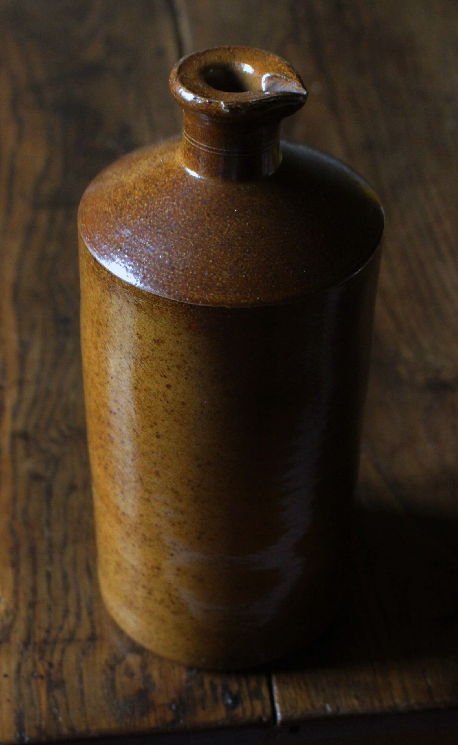 Vintage Bourne Deney stoneware liqueur bottle with pouring spout.