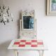 Small antique folding wooden dressing table with tiles and a mercury mirror.