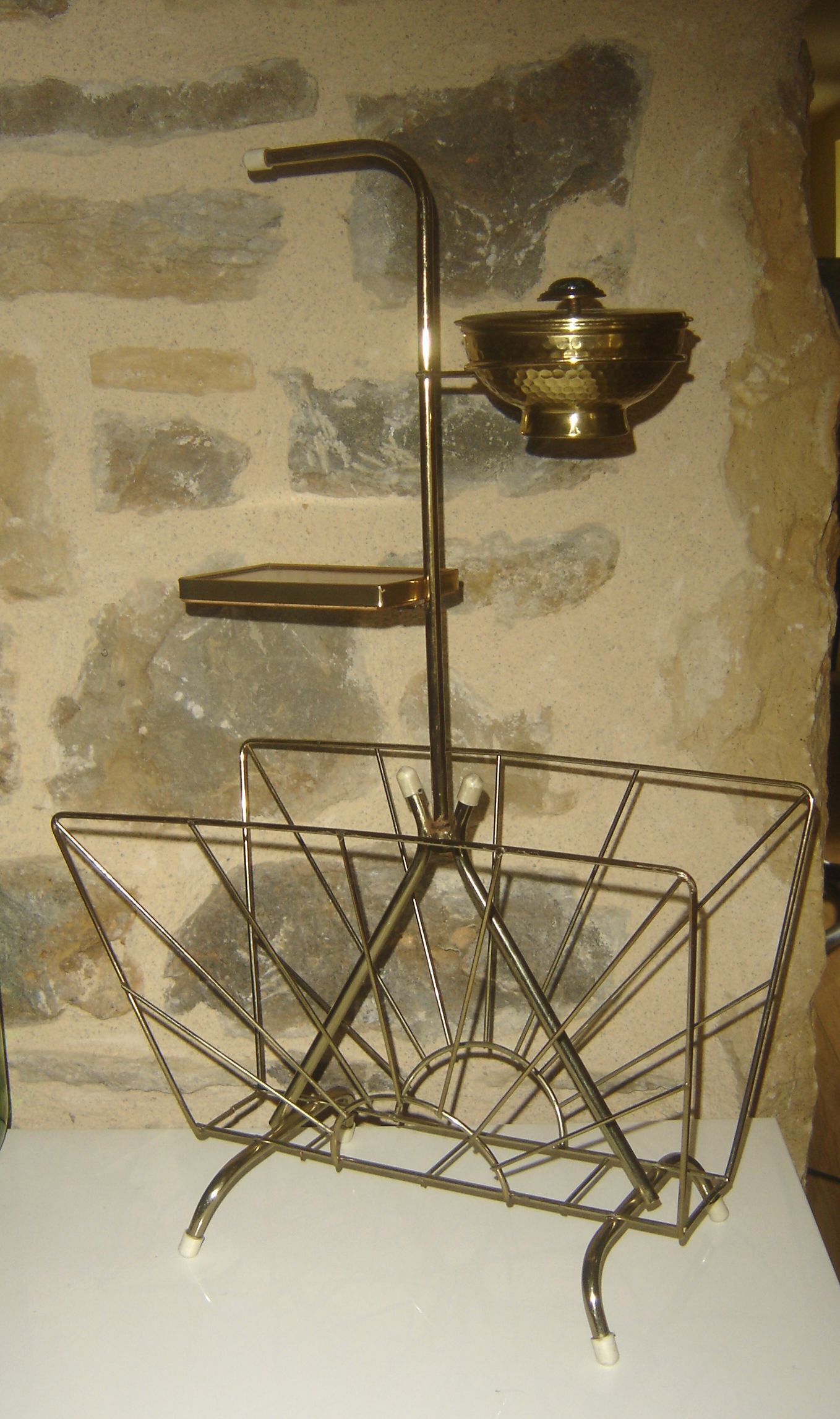 Gilded metal magazine rack and ashtray