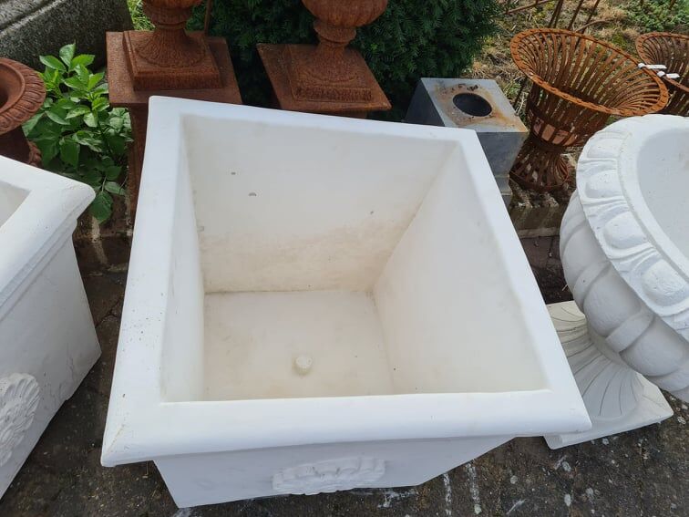 Contemporary reconstituted stone pot for the garden