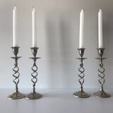 Four twisted silver candlesticks