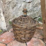 Vintage wicker demijohn